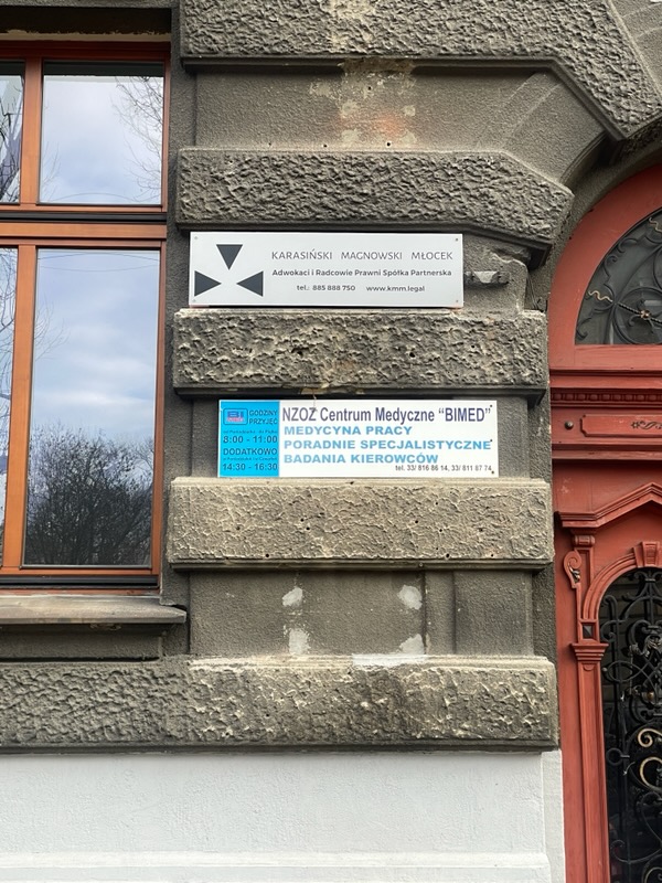 Law firm sign by the entrance at the KMM.LEGAL Bielsko-Biała office